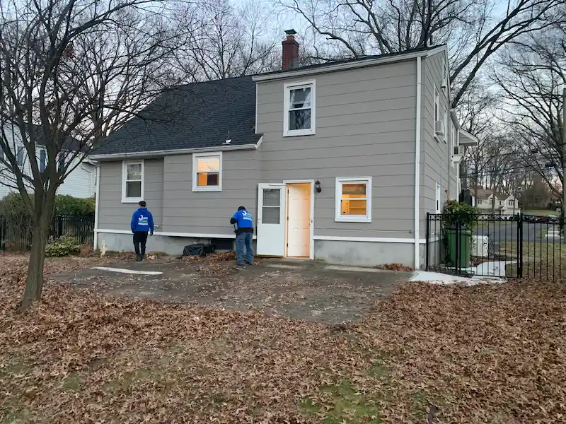 After photo: A clean, clear residential backyard patio in New Jersey after a professional yard cleanup and outdoor furniture removal service.