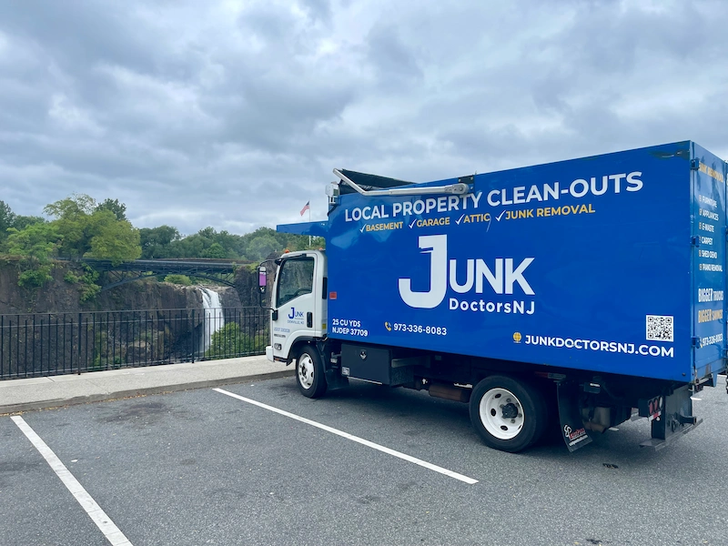 Junk Doctors NJ professional junk removal truck with CARPET listed on the door as a service, confirming reliable carpet and padding disposal.