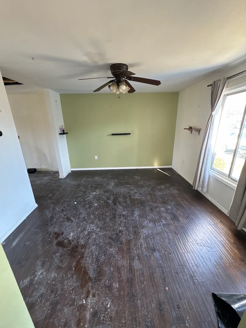 A residential room completely cleared of appliances and miscellaneous junk after a professional hauling service in New Jersey.
