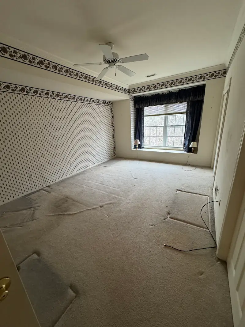 Empty, clean bedroom after a professional hauling service removed all heavy furniture and bedding.