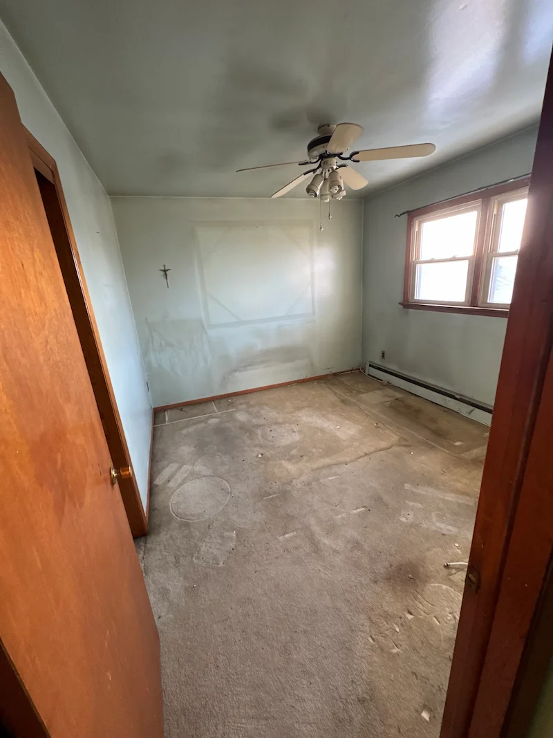 A completely cleared and swept bedroom in North Jersey following a professional estate cleanout by JunkDoctors in Montclair, New Jersey.