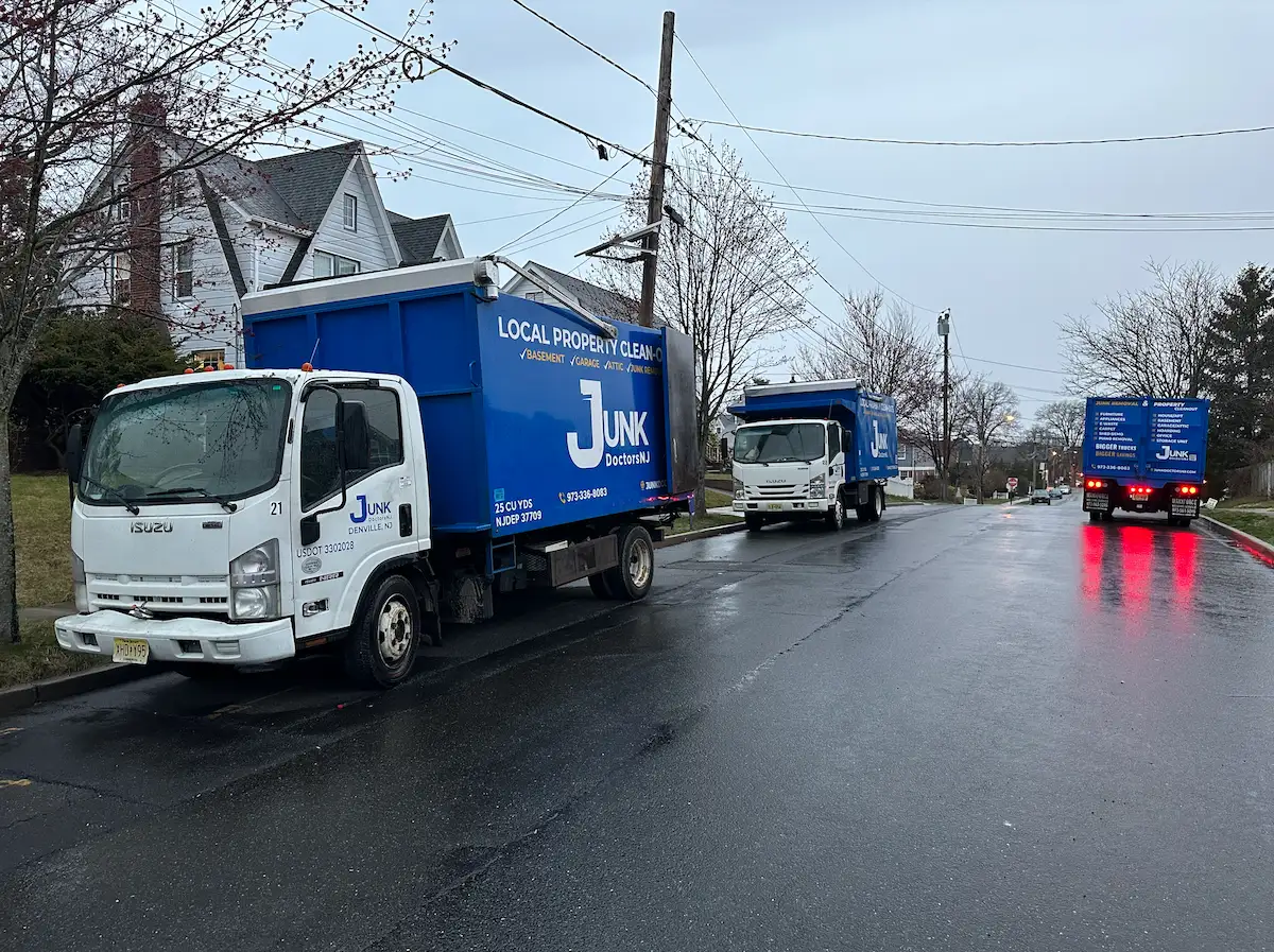 Fleet of JunkDoctors removal trucks lined up for a fast, urgent residential eviction cleanout in New Jersey.