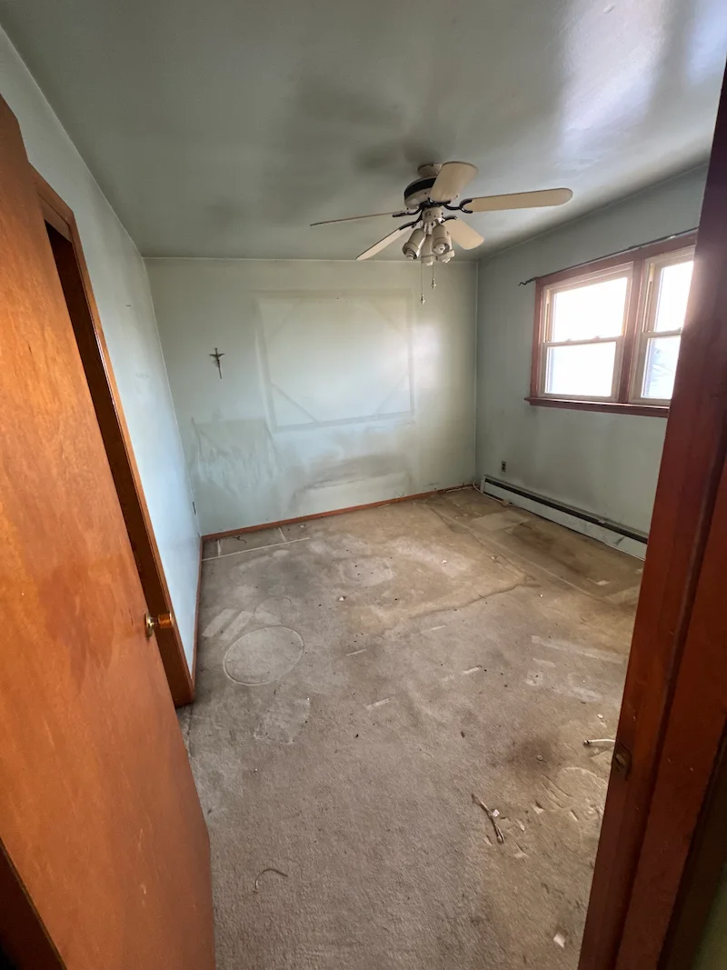 An entirely cleared, empty, and broom-clean bedroom in NJ after JunkDoctors finished a foreclosure property cleanout.
