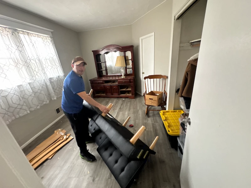 Before furniture removal in New Jersey with bulky furniture and clutter