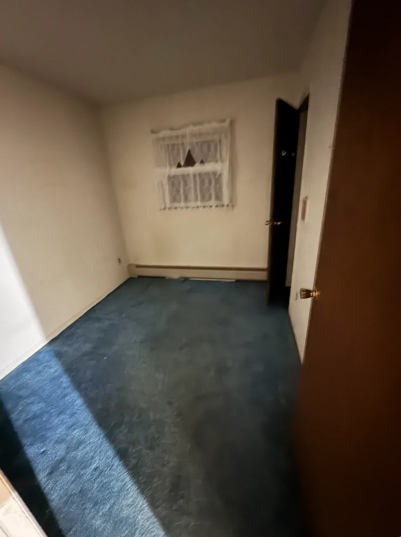 After photo of an indoor storage area cleared of all boxes and junk showing the floor and walls completely bare in Secaucus, New Jersey.