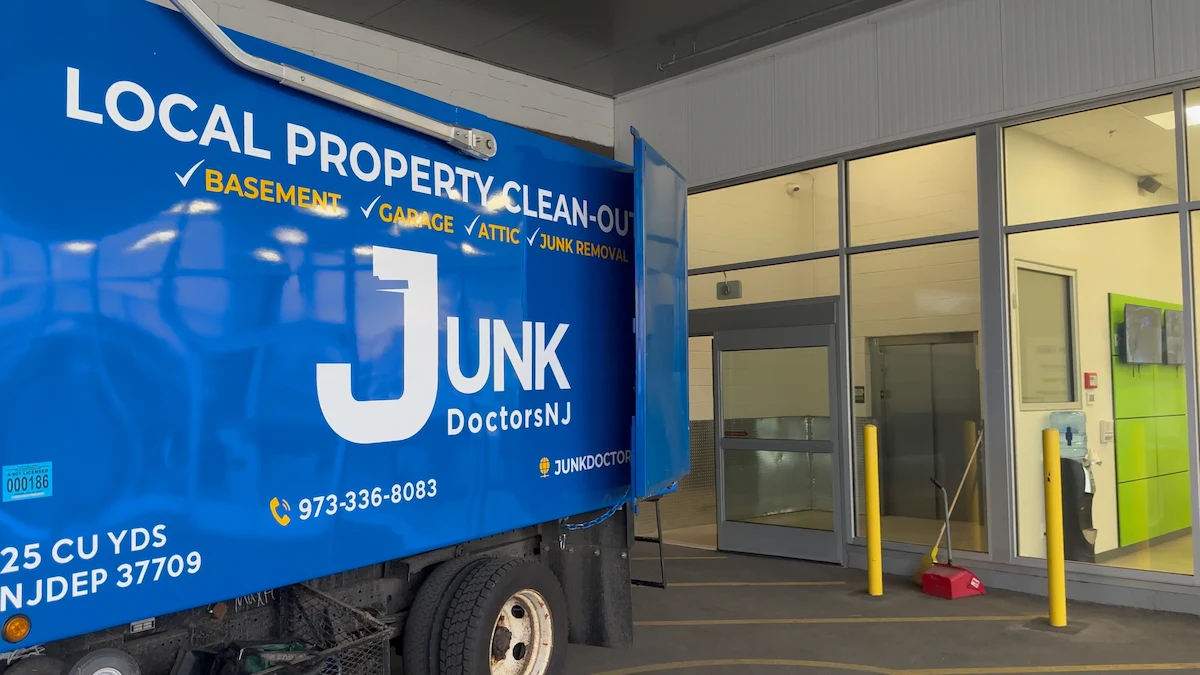 A Junk Doctors NJ 25-cubic-yard truck parked at a professional indoor storage facility for a full-service unit cleanout in North NJ.