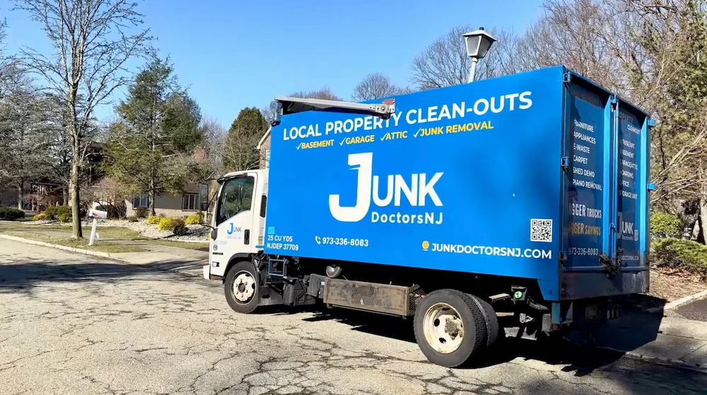 A professional JunkDoctorsNJ truck parked in a New Jersey residential neighborhood, ready to provide expert attic cleanout and junk hauling services.