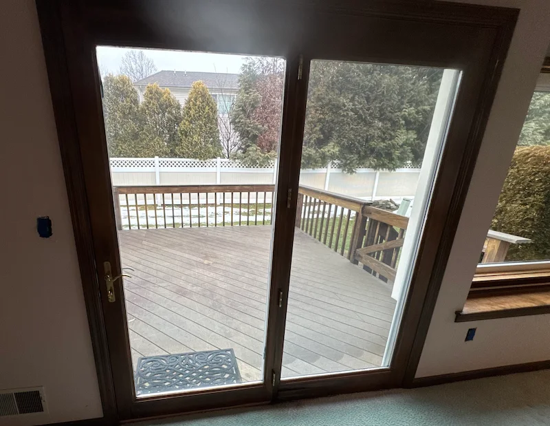 A clean, empty wooden deck in New Jersey after JunkDoctors finished a residential yard cleanup and debris removal project.