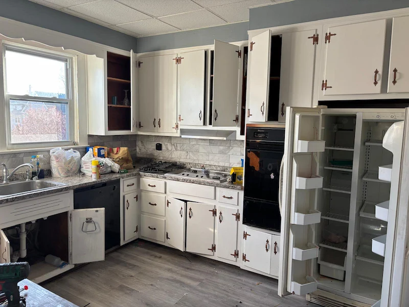 An old refrigerator in a Livingston, North Jersey kitchen before being removed and disposed of by JunkDoctors.