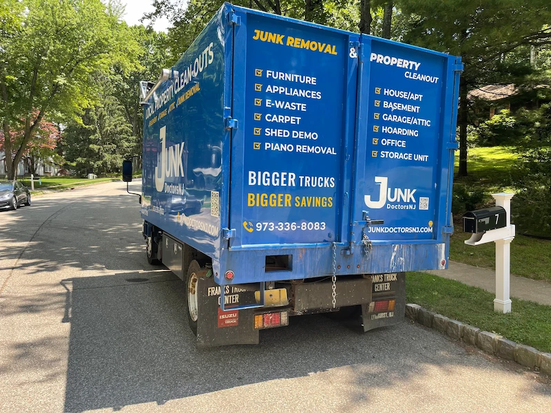 Professional JunkDoctors junk removal truck on site for a full-service residential pickup in New Jersey.