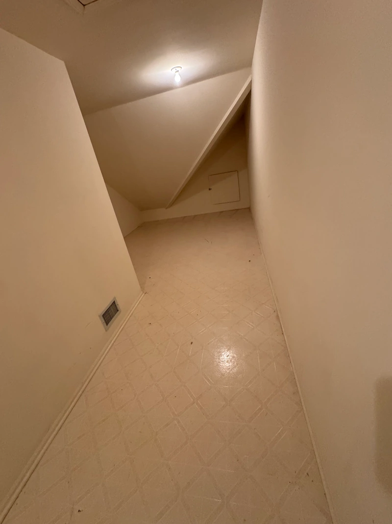 A completely empty, broom-clean residential attic in New Jersey after a professional junk removal service by JunkDoctors.