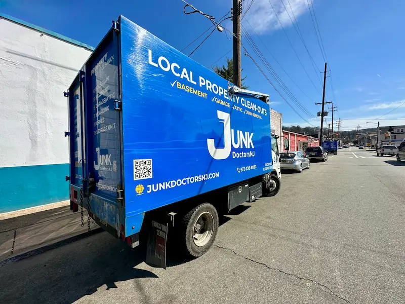 A JunkDoctors NJ professional junk removal truck parked on a commercial street, ready for a retail store cleanout and business debris hauling project in North NJ.