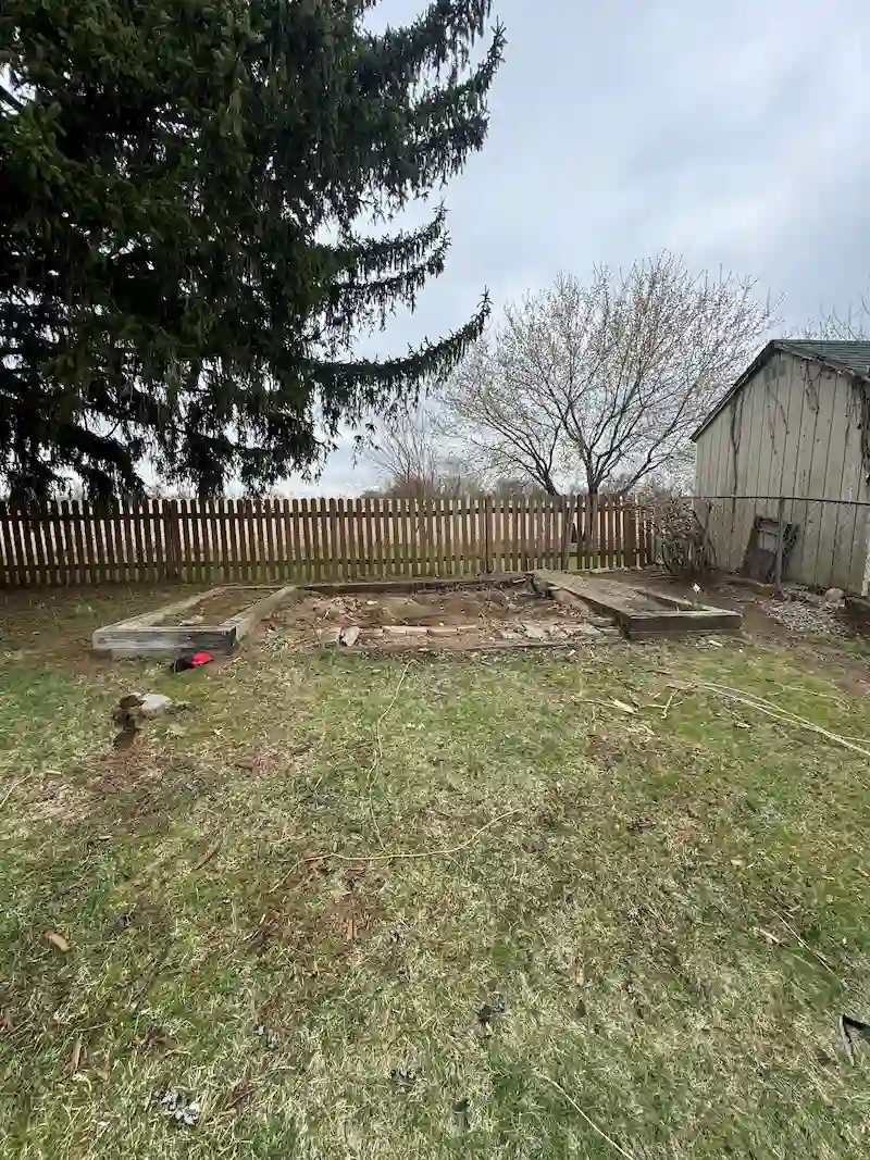A backyard in North Jersey with the shed completely removed and the area cleared of debris by JunkDoctors.