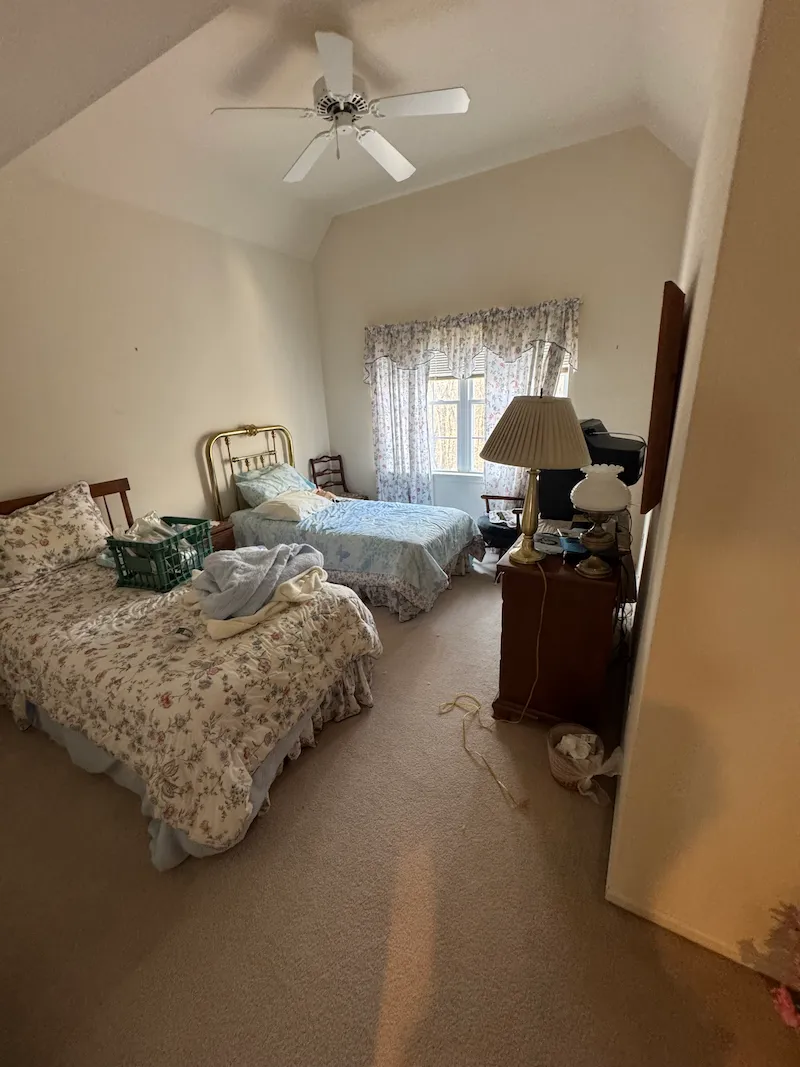Furnished bedroom before a full JunkDoctors estate cleanout in New Jersey.