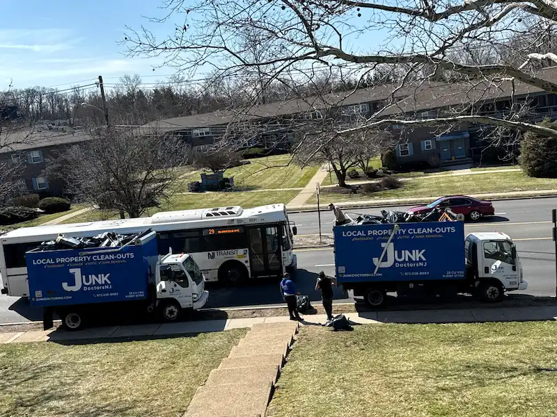 Two JunkDoctors trucks supporting a large hoarding cleanout project in New Jersey.